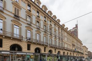 a large building on the side of a street at Elegant Home with Sauna in Turin by Wonderful Italy in Turin