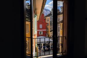 a view of a city from a window at Rifugio Guglielmini Centrale in Domodossola