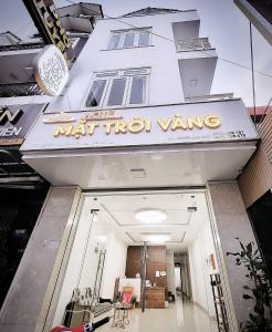 a building with a sign that reads what two wings at Mat Troi Vang Dalat Hotel in Da Lat