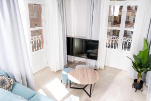 A seating area at Apartamentos Turísticos Plaza del Rey by CartagenaSpain