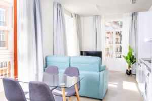 A seating area at Apartamentos Turísticos Plaza del Rey by CartagenaSpain