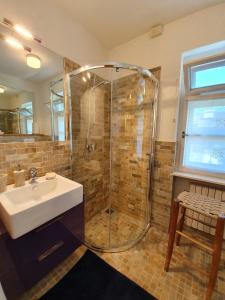 a bathroom with a shower and a sink at B&B Cristallo in Cortina dʼAmpezzo