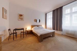 Posteľ alebo postele v izbe v ubytovaní Vita Nejedleho apartments