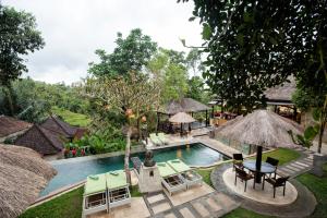 an image of a swimming pool at a resort at Beji Ubud Resort in Ubud