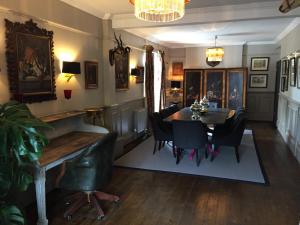 a dining room with a table and chairs at Ingram House with Hot Tub in Hurst Green