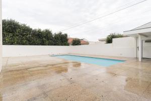 a swimming pool in the backyard of a house at GuestReady - Marinhas Beauty near Esposende Beach in Esposende +20 photos