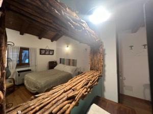 a bedroom with a bed and a wall with drawn faces on it at Ca-Jo Bed and Breakfast in Garessio
