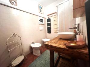 a bathroom with a sink and a toilet at Ca-Jo Bed and Breakfast in Garessio +61 photos