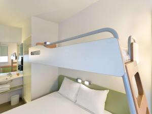 Posteľ alebo postele v izbe v ubytovaní Ibis Budget Madrid Centro Las Ventas