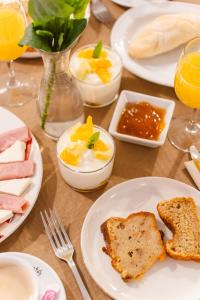a table topped with plates of food with eggs and toast at Tamahuche Hotel Rural in Vallehermoso