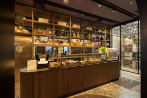 a bakery with a counter with pastries in it at Doubletree By Hilton Lima San Isidro in Lima