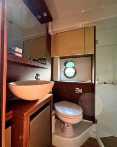 a bathroom with a sink and a toilet at Boat For Events in Naples