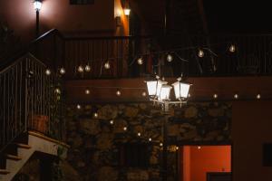 a street light in front of a building with lights at Tamahuche Hotel Rural in Vallehermoso