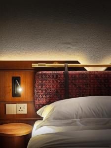 Postel nebo postele na pokoji v ubytování Bintang Collectionz Hotel