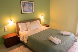 Ένα ή περισσότερα κρεβάτια σε δωμάτιο στο Chrisanthi Apartments