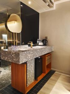 Kuchyň nebo kuchyňský kout v ubytování Bintang Collectionz Hotel