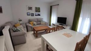 a living room with a couch and a table at Tahona in Carmona