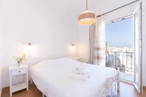 Voodi või voodid majutusasutuse Syros DouBleTS Apartments toas