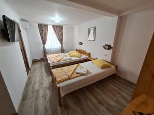 Postel nebo postele na pokoji v ubytování Sándor Panzió