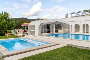 a swimming pool in the backyard of a house at 9Arches in Vila Nova de Poiares