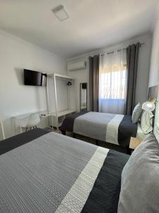 Ліжко або ліжка в номері Apartamento Mas y Prat nº 19 Ecija