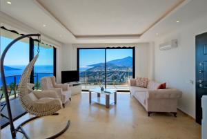 a living room with a couch and a swing at Villa Sheyma in Kalkan