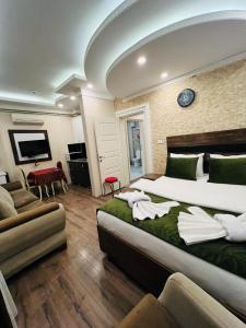 a hotel room with two beds and a tv at LALE SULTAN SÜİT APART in Istanbul