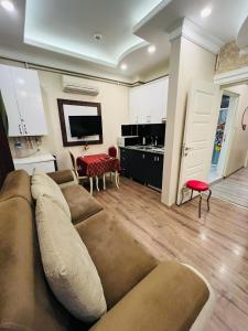 a living room with a couch and a table at Bona apart in Istanbul