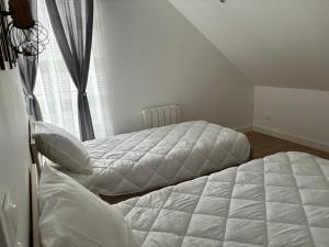 Postel nebo postele na pokoji v ubytování Charmant Appt Duplex - 8 Personnes