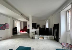TV a/nebo společenská místnost v ubytování La casa di Wayne