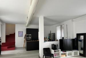 TV a/nebo společenská místnost v ubytování La casa di Wayne