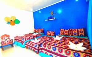 Ein Bett oder Betten in einem Zimmer der Unterkunft Villa Consuelo Pagudpud