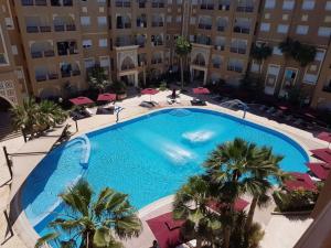 an overhead view of a large swimming pool in a building at Studio S0 FOLLA RESORT CHATT MERIEM in Sousse