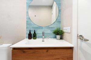 a bathroom with a sink and a mirror at Lodging Apartments Barceloneta Beach Studio 31 in Barcelona