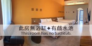 Voodi või voodid majutusasutuse Ding Jia Garden Resort toas