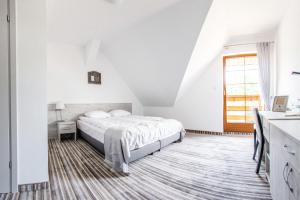 Posteľ alebo postele v izbe v ubytovaní Hotel Przy Dworze