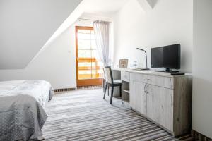 Posteľ alebo postele v izbe v ubytovaní Hotel Przy Dworze
