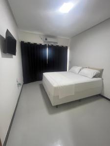 Voodi või voodid majutusasutuse Piranhasvillage03 toas