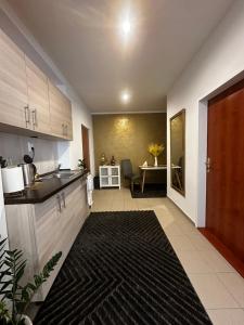 a kitchen with a sink and a counter top at Apartment Reduta Celebration in Poprad