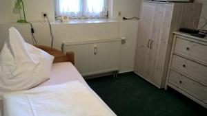 Katil atau katil-katil dalam bilik di Pension Schloßwache-Zerbst