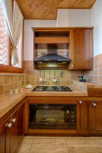 Kuchyň nebo kuchyňský kout v ubytování Residence Palazzo Gasparroni