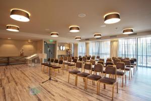 a conference room with chairs and a podium in it at Congo Palace in Athens
