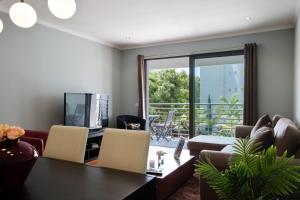 a living room with a couch and a table at GuestReady - A sunny delight in Funchal in Funchal