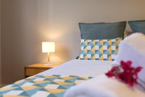 Ένα ή περισσότερα κρεβάτια σε δωμάτιο στο GuestReady - Serenity by the Sea near Funchal Bay