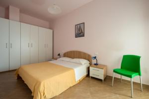 Postel nebo postele na pokoji v ubytování Residence Palazzo Gasparroni