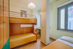 Postel nebo postele na pokoji v ubytování Residence Palazzo Gasparroni