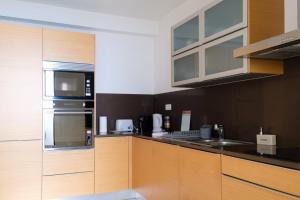 Kuchyň nebo kuchyňský kout v ubytování GuestReady - Charming Caniço Retreat