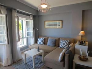 a living room with a couch and a table at Barreirinha II Near Old Town With Nice Ocean Views in Funchal