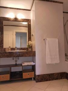 a bathroom with a sink and a mirror at GuestReady - Vila Formosa in Funchal