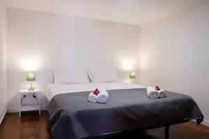 Postel nebo postele na pokoji v ubytování GuestReady - Machico sea view residence - B
